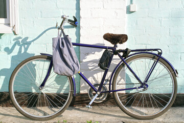 Road bike with a bag on the handlebars. A regular simple bike.