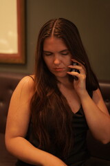 Fototapeta premium Woman Using Smartphone in Café