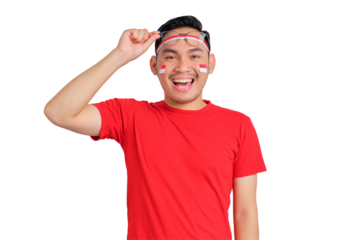 Happy young Asian man celebrating Indonesian independence day takes off glasses isolated on transparent background