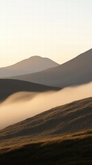 Mountain with gentle hills and rolling terrain under a bright blue sky and fluffy clouds