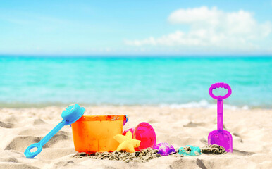 Children's beach toys on the sand and sea.