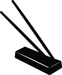 sushi chopsticks resting on holder on white 