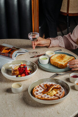 Elegant Brunch Waffles French Toast and Berries in a Serene Setting