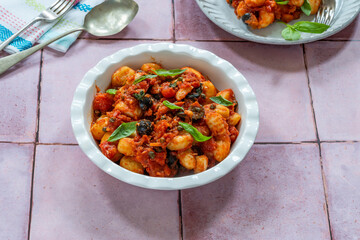 Potato gnocchi with puttanesca sauce