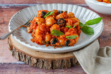 Potato gnocchi with puttanesca sauce