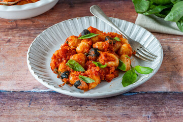 Potato gnocchi with puttanesca sauce