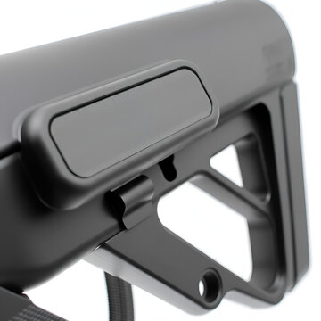 Black adjustable rifle stock, commonly used in firearms for stability and comfort, featuring a textured buttplate and a lever for length adjustment. Isolate on white back