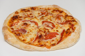 Rustic-style pizza topped with cheese, bacon, and tomato slices, fresh from the oven. Great for culinary websites and menus.