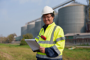 Engineers are checking the working system of a fresh food factory producing ducks, chickens and pork outside the building.