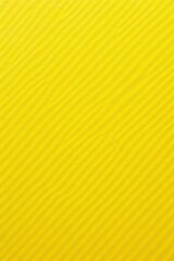 Close-up textured yellow fiber paper background, light, golden background, fiber