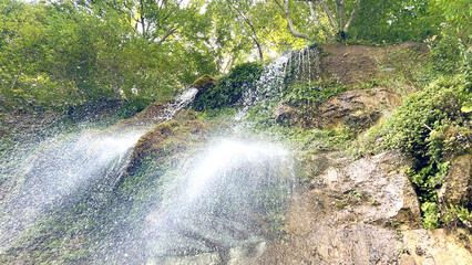 Scenic waterfall in lush forest of dagestan - natural beauty and tranquility for nature lovers