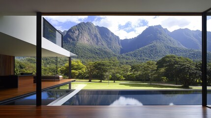 Contemporary home with pool blending into lush landscape offering a peaceful retreat and relaxation inside minimalist aesthetic