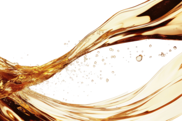 Golden liquid pours in a dynamic wave, with bubbles and droplets scattered