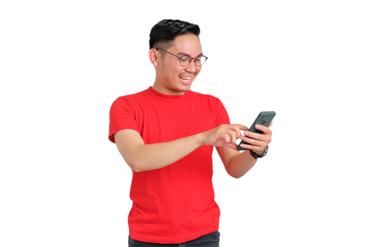 Portrait of smiling young Asian man using mobile phone for typing SMS messages isolated on transparent background