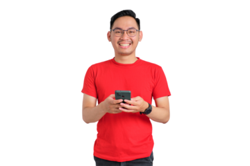 Portrait of smiling young Asian man holding mobile phone and looking at camera isolated on transparent background