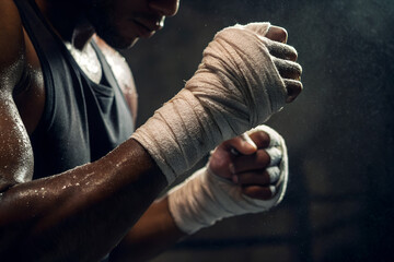 Boxer Preparing for Fight — Focused Athlete with Hand Wraps in Gym