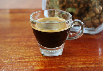Freshly Brewed Civet Coffee or Kopi Luwak in a transparent cup