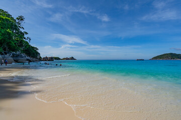 Empty tropical beach and seascape, Beautiful sandy beach and sea in sunny day,Blue sky in good weather day, Beach sea space area nature background