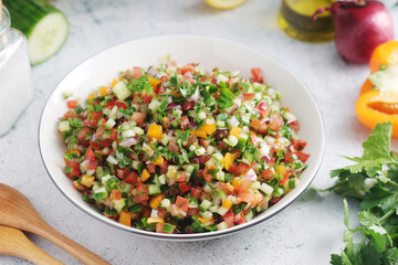 A bowl with traditional Israeli Salad