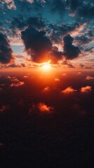 Fototapeta premium A breathtaking aerial view of a fiery sunset, with vibrant clouds and a golden sun