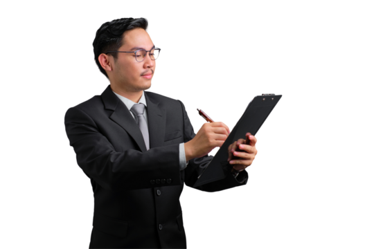 Handsome Asian businessman in suit writing on clipboard with pen, isolated on transparent background
