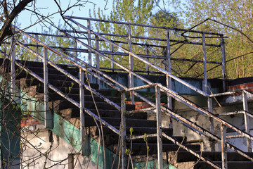 Weathered Concrete Exterior Stairs With Rusty Metal Railings On An Old Derelict Or Abandoned...