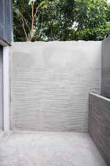 Obraz premium Concrete wall plastering and rough surface or scratch texture pattern for bonding fixing with tile inside toilet and bathroom under construction work. 