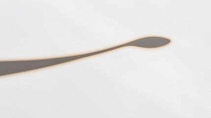 A minimalist line drawing of a spoon.