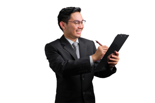 Handsome Asian businessman in suit smiling while writing on clipboard, isolated on transparent background