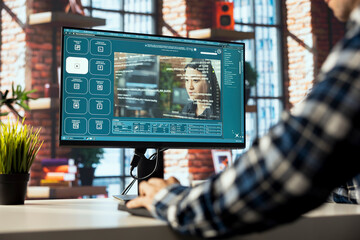 Man sitting at PC using software processing text input, generating video frames and saving output as video files. Person uses website for GPT text analysis, transforming text into video