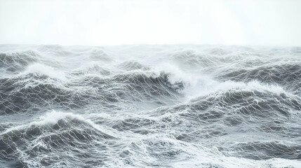 Rough, gray sea waves crash against each other,  creating a chaotic, tempestuous scene.  Light gray sky