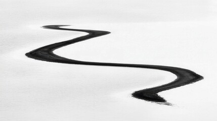 A winding black line traverses a snowy landscape.