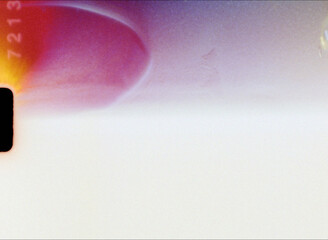 Light leaks and film burn creating abstract pink and purple background texture