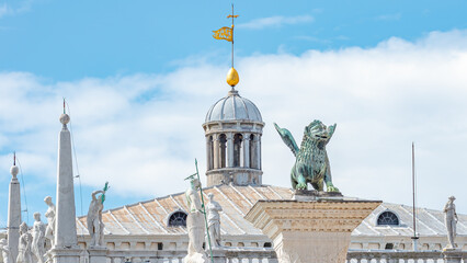Panoramic view over San Marco square roof top towers, sculptures and the symbol of Venice a winged lion at Doge Palace, Venice, Italy, summer time, closeup, details