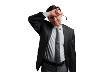 Handsome Asian businessman in suit looking stressed and tired, wiping forehead with glasses in hand, isolated on transparent background