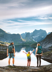 Family vacation in Norway - parents and child hiking in Lofoten Islands explore mountain trails, father mother and kid on active summer tour adventure holidays outdoor fun and healthy lifestyle hobby