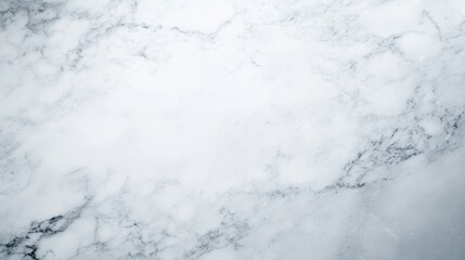 A textured white marble surface with gray veins.