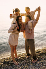 Happy family relax on vacation, adventure, bonding and playing together. Parents, children have fun in nature. happy family having fun outdoors