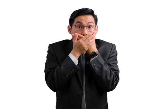 Handsome Asian businessman in suit covering mouth with hands, showing surprise or shock, isolated on transparent background