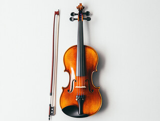 Fototapeta premium A violin resting upright with its bow leaning against it, set against a plain white background
