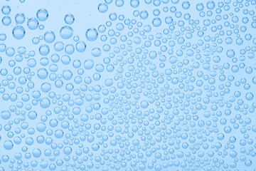 Soda water with bubbles as background, closeup