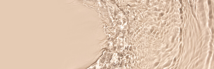 water texture ripples wave clean transparent water abstract background in beige color