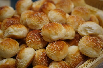 Pile of Golden Brown Sesame Seed Bread Rolls