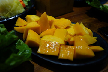 Close-up of Fresh Cubed Mango and Dragon Fruit on Dark Plate – Tropical Fruit Platter