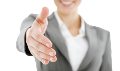 Professional Business Person Extending Hand for a Firm Handshake in a Business Environment