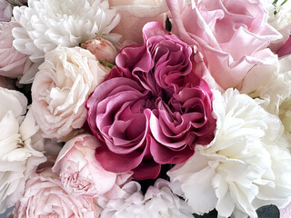 Elegant bouquet of pink and white roses with lush blossoms
