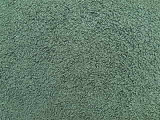 Close up texture of green upholstery fabric, made of cotton and wool in a scaled square pattern. Blue tosca green fabric suitable for clothing. Seamless background fabric texture.