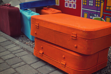 A Colorful Collection of Vintage Suitcases Enhancing Urban Decor and Evoking Travel Memories and Nostalgia