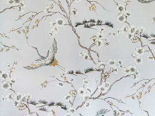 Close up of floral tree branches and bird theme printed wallpaper. Suitable for wall covering and...