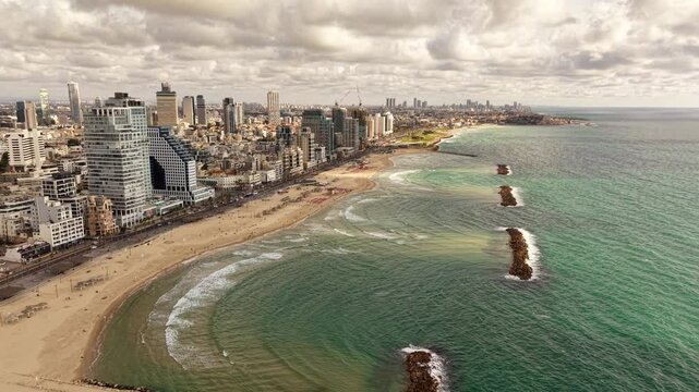 Aerial video of Tel Aviv Jaffa coastline in Israel during daylight 